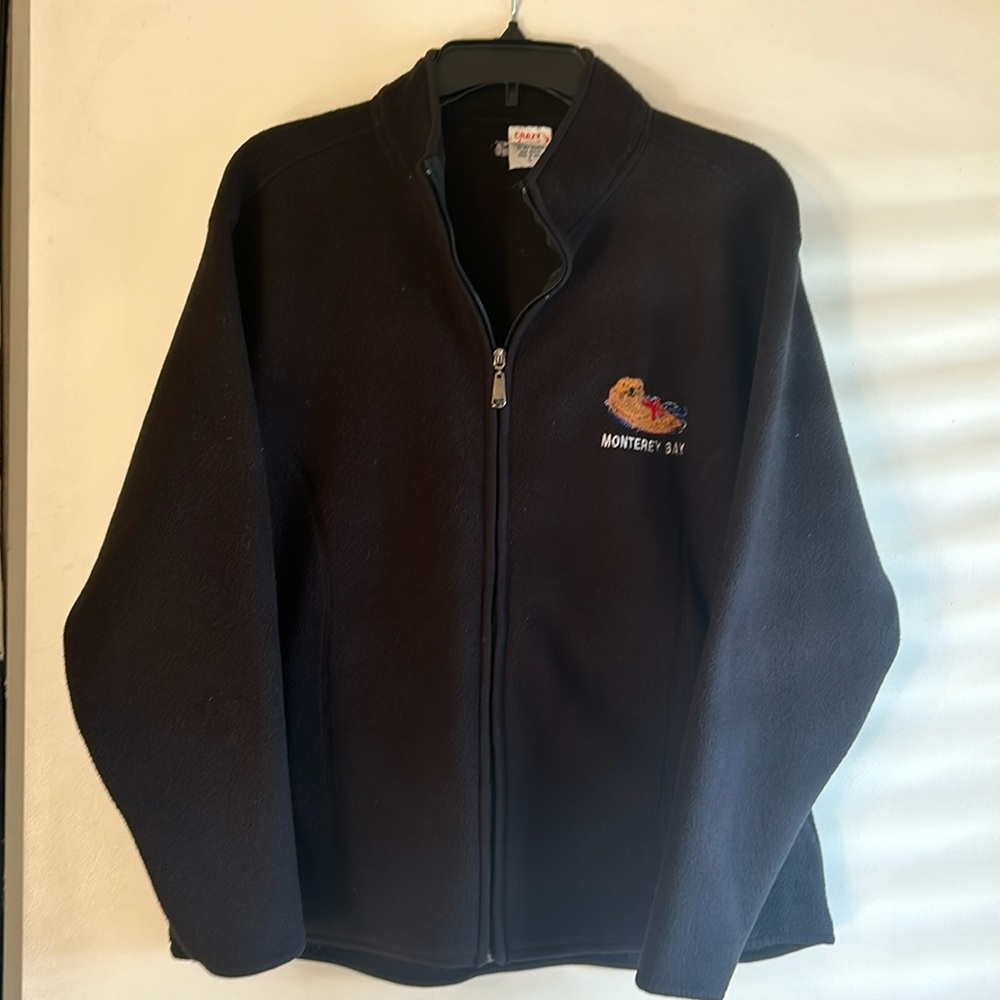 Brand new zip up Monterey Bay black sweatshirt. Never worn. Size large.